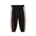 Pantaloni sportivi neri per bambini con inserti grigi e strisce arancioni laterali - 90cm / Nero