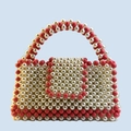 Handmade woven pearl handbag with red acrylic beads in a classic contrasting color design - Red and White