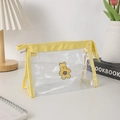 Detail of transparent PVC pencil case with cute yellow bear print and metal zipper closure - Yellow