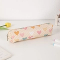 Detail of quilted beige PU pencil case with colorful heart patterns and metal zipper closure - Yellow/Beige