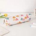 Close-up of heart pattern pencil case with V-shaped chevron quilting and metal zipper - White