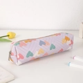 Close-up of lavender quilted heart pencil case with silver metal zipper and soft PU finish - Purple