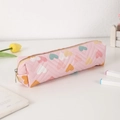 Detail of pink PU pencil case featuring quilted V-lines and colorful heart patterns - Pink
