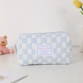 Detail of blue checkerboard pencil case with sweet girl label and textured fabric - Blue