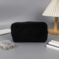 Macro detail of the black waffle texture fabric and zipper on this large pencil case - Black