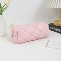 Close-up of pink quilted pencil case with soft diamond texture and zipper closure - Pink