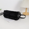 Detail of soft black faux fur pencil case with leather handle and smooth metal zipper - Black