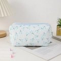 Close-up of quilted floral pencil case with soft fabric texture and blue zipper detail - Blue Floral