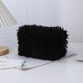 Detail shot of a soft black plush pencil case with long faux fur and silver zipper - Black