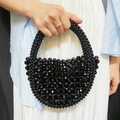 Handmade black beaded crescent handbag featuring faceted resin beads in a mini size - Black