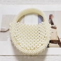 Handmade beaded crescent handbag in creamy white pearl finish with round top handle - White (Pearl)
