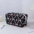 Detail of floral pencil case showing red rose patterns and durable metal zipper closure - Black