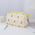 Detail of quilted floral pencil case with yellow ribbons and red rose patterns - Yellow