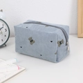 Detail of light blue corduroy cosmetic bag with bear pattern and silver metal zipper closure - Blue Bear