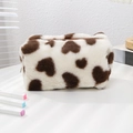 Macro detail of plush heart pattern pencil case with soft texture and sturdy zipper - Brown Heart