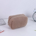 Detail of soft brown plush pencil case with metallic zipper and fluffy texture finish - Coffee