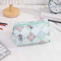 Detailed view of a green checkered stationery pouch with cute cartoon animal patterns - Green