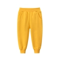 Vibrant yellow kids' cotton joggers featuring elastic waist and ribbed ankle cuffs - 90cm / Gold