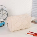 Detailed view of cream quilted nylon pencil case with diamond stitch and zip closure - Solid Light Beige