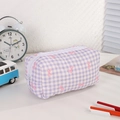 Macro shot of purple gingham quilted pencil case with cute pink bow pattern and zipper - Purple Bow