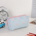 Detailed view of blue gingham pencil case with pink bows and quilted cotton texture - Blue Bow