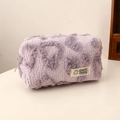 Close-up of plush purple leopard makeup bag with metal zipper and Colorful Fantasy label - Purple