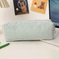 Macro detail of seersucker pencil case with green striped fabric and metal zipper - Green Stripes