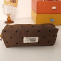 Detailed view of brown polka dot corduroy pencil case with zipper and bear patch - Coffee