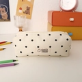 Detailed close-up of canvas polka dot pencil case with a cute woven logo and sturdy zipper - Off White