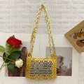 Detail of handmade metallic chainmail bag featuring gold and silver woven ring patterns - Gold and Silver Two-tone