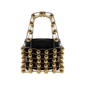 Detailed shot of the gold hollow metal cage and polished spheres on the handbag - Gold