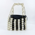 Detail of woven gold metal frame with large white pearls and black drawstring inner bag - Gold with Pearls (White)