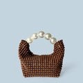 Handmade brown beaded handbag featuring large white pearl handle in a crescent shape - Coffee