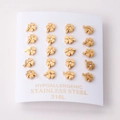 Detailed view of ten pairs of gold-plated 316L stainless steel clover stud earrings - Gold Color Clover Style With Zirconia (EA100702G)