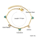 Détail d'un bracelet en acier doré avec papillons bleus et zircons ronds brillants - Papillon bleu (BR26250KG)