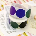 Roll of multi-color circular adhesive labels with purple, blue, green, and yellow dots - Round Multi-color Mix (C84) / 1 inch / 500 stickers