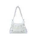 Macro detail of hand-woven transparent acrylic beads with a white fabric liner bag - Clear