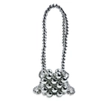 Macro detail of silver electroplated beaded handbag with polished mirror finish surface - Silver