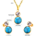 Vista de cerca de conjunto de joyas de acero inoxidable dorado con piedras turquesas - Estilo de Doble Círculo Dorado (SE229402G)