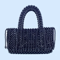 Detail of hand-woven black beaded tote bag featuring high-gloss beads and fringe tassel - Black