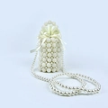 Elegant white pearl bucket bag with drawstring satin closure and beaded handle - White
