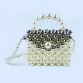 Detail of handmade beaded mini bag with off-white pearls and silver metallic beads - White