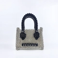 Detail of beaded mini handbag featuring a silver and black pearl expression pattern - Silver