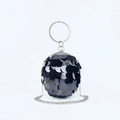 Detail of spherical evening bag with black sequins, crystal ring handle, and silver chain - Black