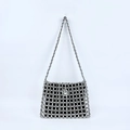 Detailed view of silver beaded shoulder bag featuring hollow woven pattern and black inner pouch - Silver