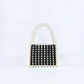 Detail of handmade beaded handbag with black and white resin pearls in vertical stripes - Black and White