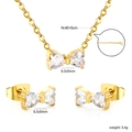 Golden bow-shaped stainless steel necklace and earrings set with heart-cut crystals - Gold Bowknot Style (SE26890AG)