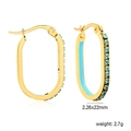 Detail view of oval gold hoop earrings with sky blue stones and enamel inlay, 22mm size - Gold Sky Blue Style (EA33330KG)