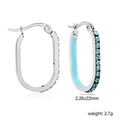 Detail of oval stainless steel hoop earrings with teal crystals and blue enamel inlay - Silver Sky Blue Style (EA33330KS)