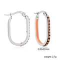 Close-up of oval stainless steel hoop earrings with orange stones and enamel finish - Silver Orange Style (EA33330LS)